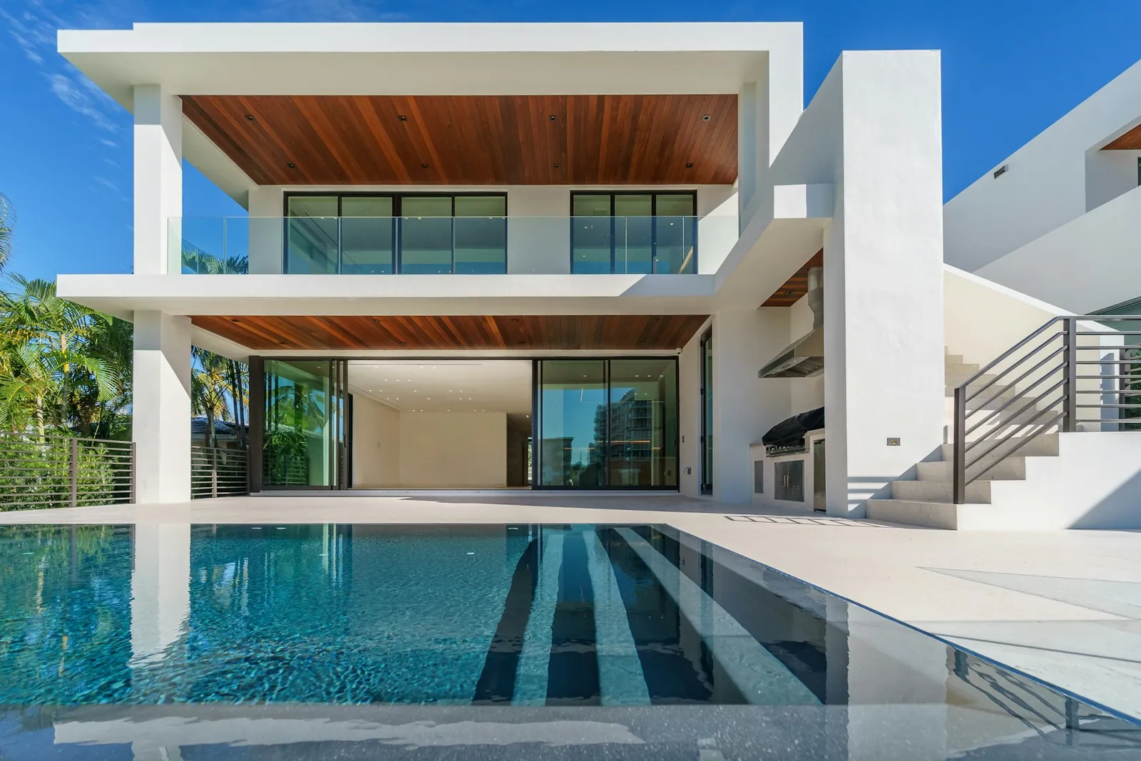 Representative image of a contemporary white villa with an infinity pool
